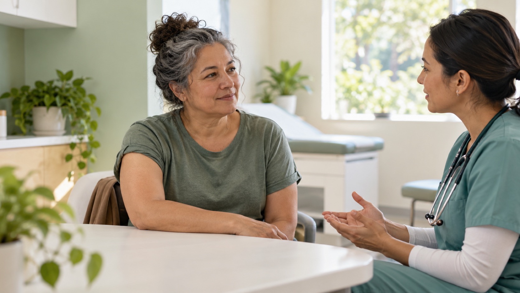 An adult speaks with a nurse in a bright community clinic.