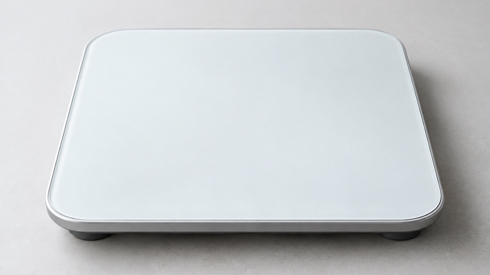 Unmarked digital scale on a level floor.